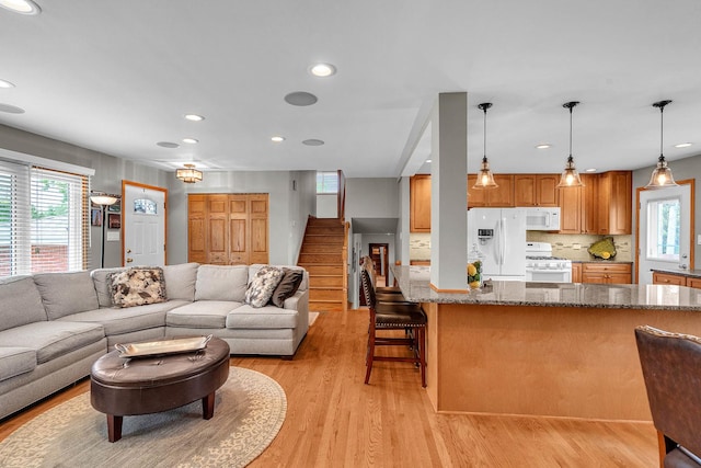 851 Munroe Cir, Des Plaines, IL 60016 - living area featuring light wood-style floors, plenty of natural light, stairs, and recessed lighting