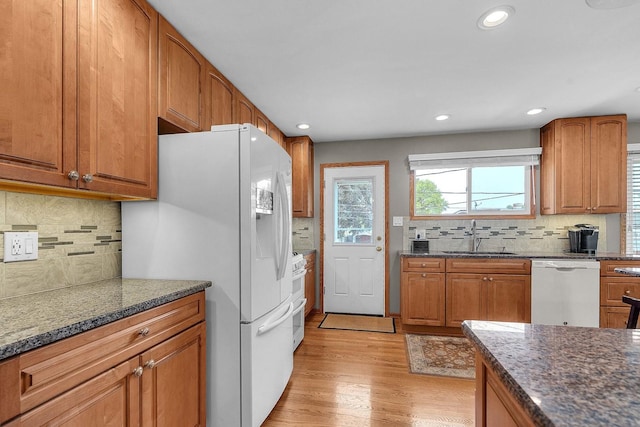 851 Munroe Cir, Des Plaines, IL 60016 - kitchen featuring a sink, white appliances, tasteful backsplash, brown cabinets, and recessed lighting
