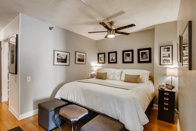 474 N Lake Shore Dr Unit 2012, Chicago, IL 60611 - bedroom featuring wood finished floors, a textured ceiling, baseboards, and a ceiling fan