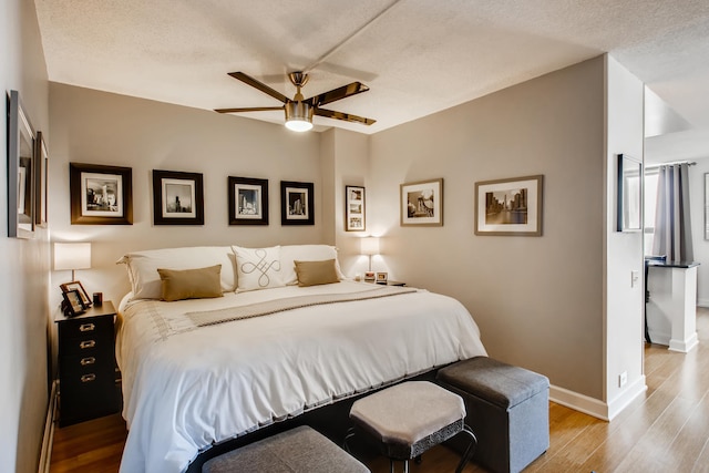 474 N Lake Shore Dr Unit 2012, Chicago, IL 60611 - bedroom with wood finished floors, baseboards, a textured ceiling, and ceiling fan