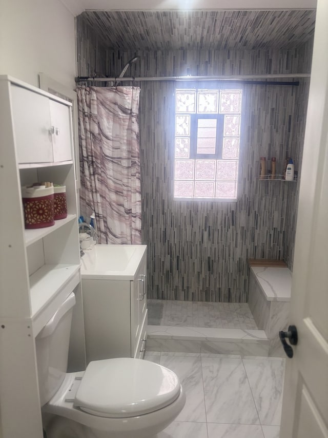 2720 N Budd St, River Grove, IL 60171 - bathroom with toilet, marble look tile flooring, tiled shower, and vanity