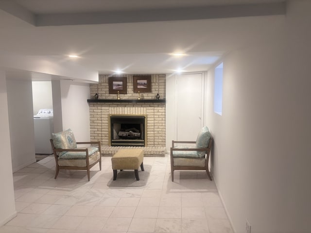 2720 N Budd St, River Grove, IL 60171 - living area with washer / clothes dryer, baseboards, and a brick fireplace
