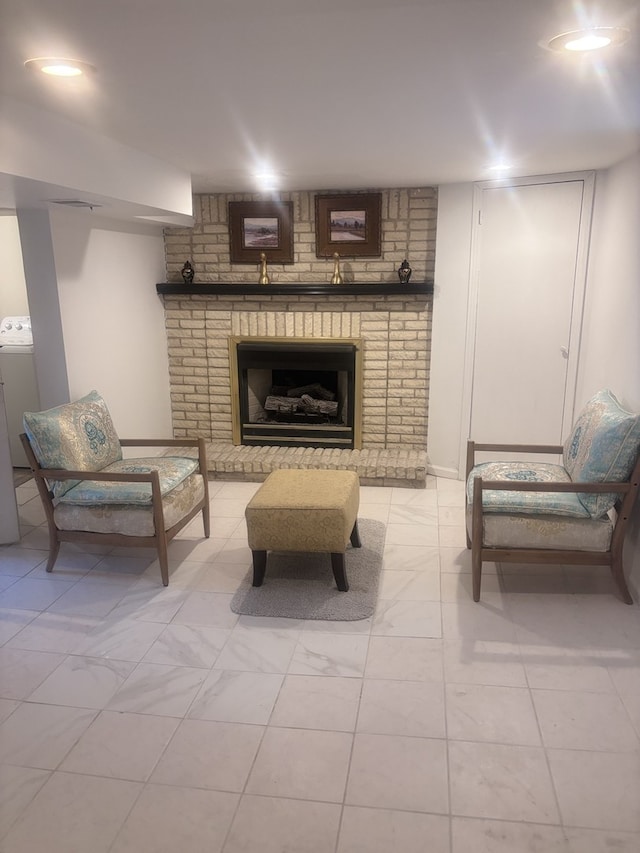 2720 N Budd St, River Grove, IL 60171 - living area with washer / dryer, a fireplace, and light marble finish floors