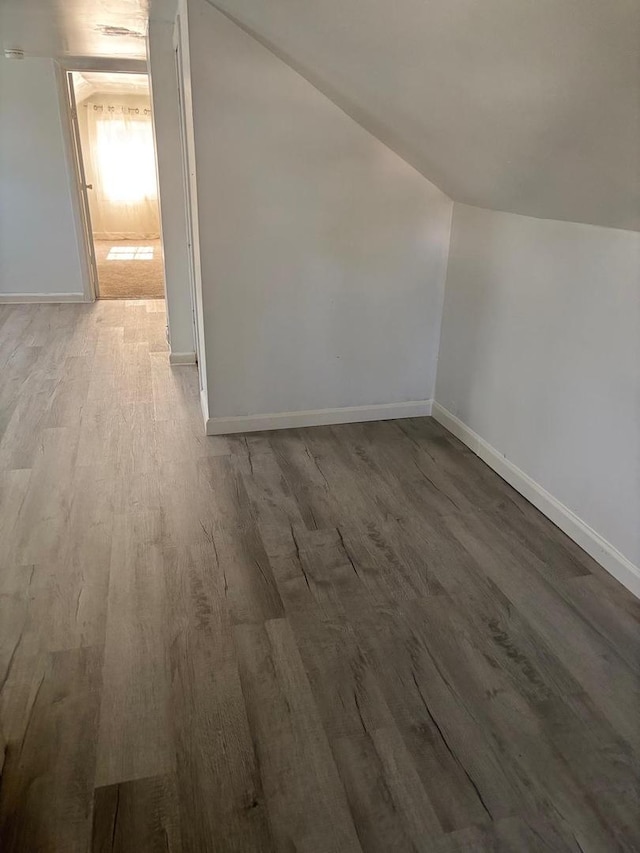 2720 N Budd St, River Grove, IL 60171 - additional living space with wood finished floors, vaulted ceiling, and baseboards