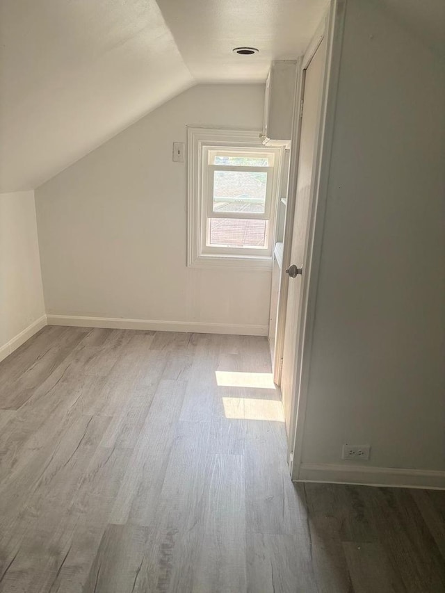2720 N Budd St, River Grove, IL 60171 - bonus room featuring lofted ceiling, wood finished floors, and baseboards