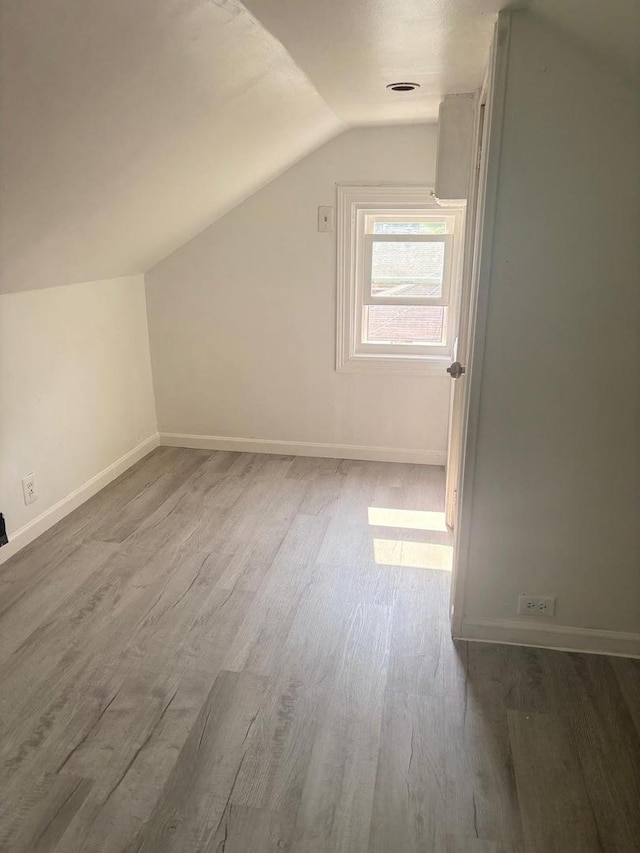 2720 N Budd St, River Grove, IL 60171 - bonus room with lofted ceiling, wood finished floors, and baseboards
