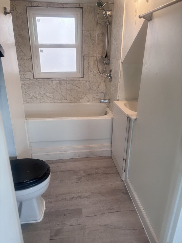 2720 N Budd St, River Grove, IL 60171 - full bath with washtub / shower combination, toilet, vanity, and wood finished floors