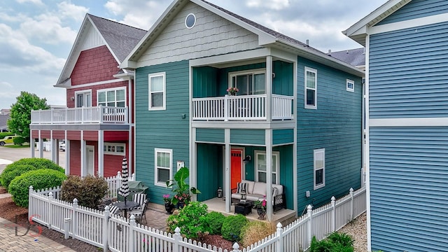 7 Pelican, Ottawa, IL 61350 - view of front facade featuring a balcony, an outdoor hangout area, and a shingled roof