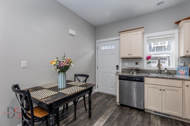 7 Pelican, Ottawa, IL 61350 - kitchen featuring stainless steel dishwasher, a sink, dark wood-style flooring, white cabinetry, and dark countertops