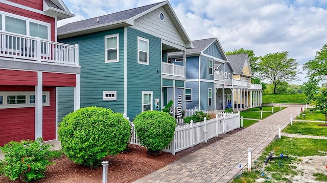 7 Pelican, Ottawa, IL 61350 - view of property exterior featuring fence and a shingled roof