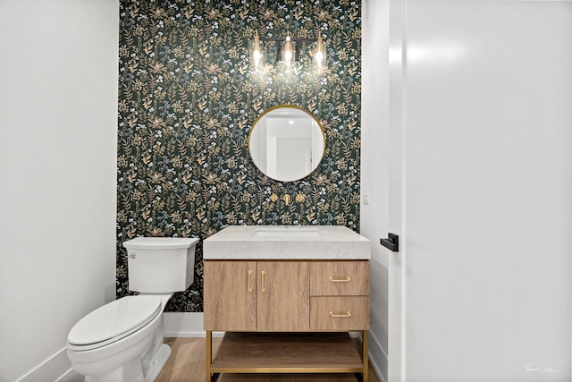 8740 Adria Ct, Orland Park, IL 60462 - bathroom featuring wallpapered walls, baseboards, toilet, vanity, and wood finished floors