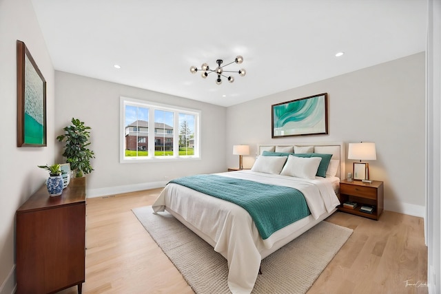 8740 Adria Ct, Orland Park, IL 60462 - bedroom with light wood finished floors, baseboards, recessed lighting, and a chandelier