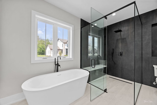8740 Adria Ct, Orland Park, IL 60462 - bathroom with healthy amount of natural light, a stall shower, a soaking tub, baseboards, and recessed lighting