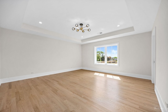 8740 Adria Ct, Orland Park, IL 60462 - unfurnished room with a tray ceiling, a chandelier, light wood-type flooring, baseboards, and recessed lighting