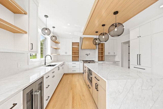 8740 Adria Ct, Orland Park, IL 60462 - kitchen with open shelves, a sink, beverage cooler, light wood finished floors, and stainless steel oven