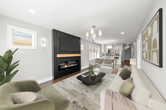 3412 Sunnyside Ave, Brookfield, IL 60513 - living room featuring baseboards, wood finished floors, recessed lighting, a chandelier, and a fireplace