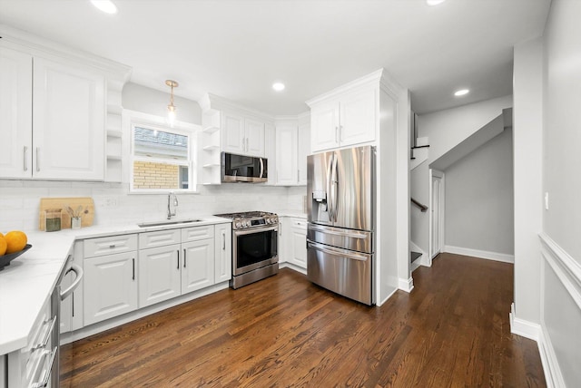 3412 Sunnyside Ave, Brookfield, IL 60513 - kitchen with appliances with stainless steel finishes, a sink, open shelves, dark wood-type flooring, and white cabinetry