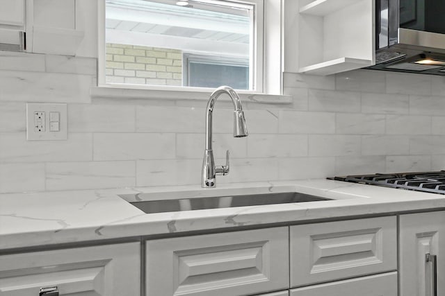 3412 Sunnyside Ave, Brookfield, IL 60513 - kitchen with a sink, stainless steel microwave, and white cabinets