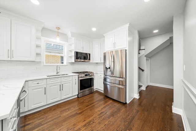 3412 Sunnyside Ave, Brookfield, IL 60513 - kitchen with stainless steel appliances, a sink, open shelves, dark wood finished floors, and white cabinetry