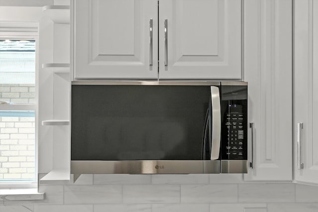 3412 Sunnyside Ave, Brookfield, IL 60513 - kitchen view of stainless steel microwave and white cabinetry