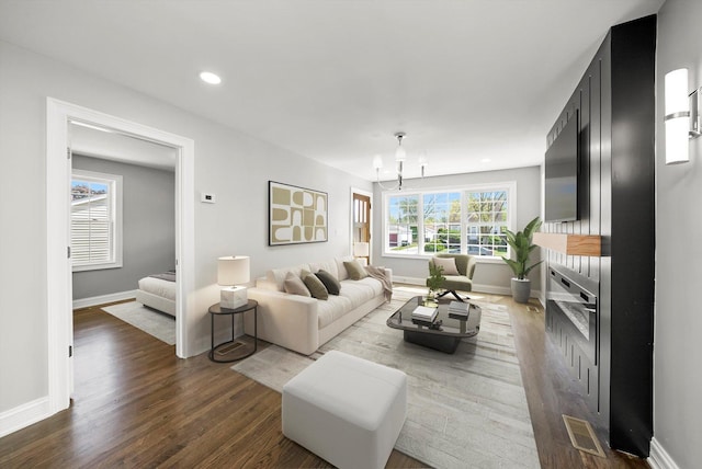3412 Sunnyside Ave, Brookfield, IL 60513 - living area with a chandelier, dark wood-style floors, baseboards, and recessed lighting