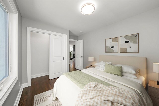 3412 Sunnyside Ave, Brookfield, IL 60513 - bedroom with dark wood-style flooring, a closet, and baseboards
