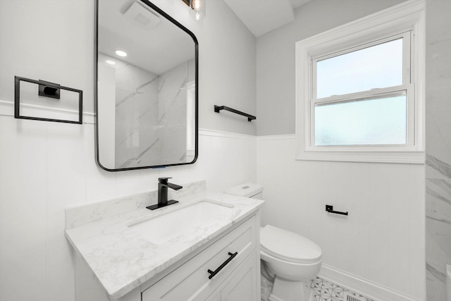 3412 Sunnyside Ave, Brookfield, IL 60513 - full bath featuring toilet, vanity, a wainscoted wall, and a marble finish shower