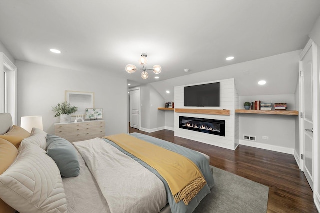 3412 Sunnyside Ave, Brookfield, IL 60513 - bedroom featuring a glass covered fireplace, wood finished floors, a chandelier, recessed lighting, and baseboards