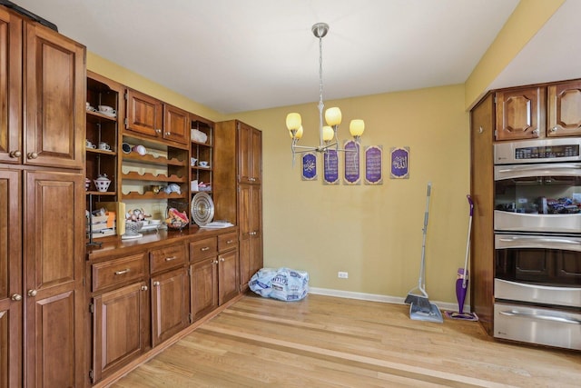 51 Oak Creek Dr, Burr Ridge, IL 60527 - dining room featuring light wood-style floors, a chandelier, and baseboards