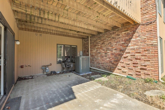 51 Oak Creek Dr, Burr Ridge, IL 60527 - doorway to property featuring central AC, a patio area, and brick siding