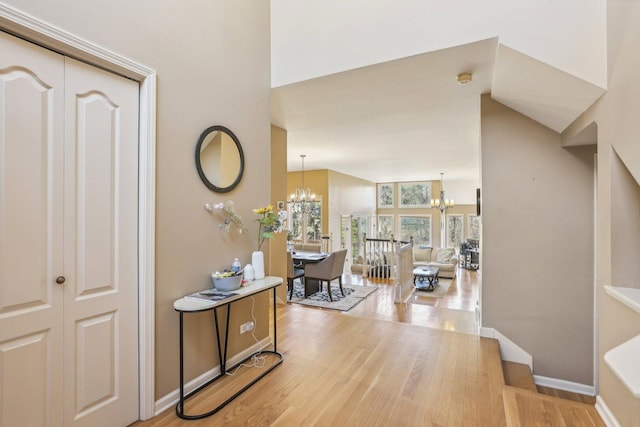 51 Oak Creek Dr, Burr Ridge, IL 60527 - foyer with a chandelier, light wood-style floors, and baseboards