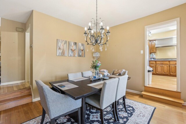 51 Oak Creek Dr, Burr Ridge, IL 60527 - dining room featuring light wood finished floors, a chandelier, and baseboards