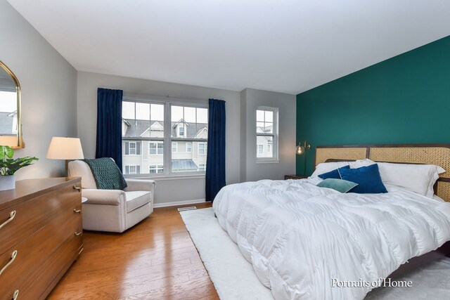 435 N Commerce St, Aurora, IL 60504 - bedroom featuring wood finished floors and baseboards