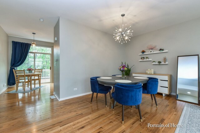 435 N Commerce St, Aurora, IL 60504 - dining space with a chandelier, light wood finished floors, and baseboards