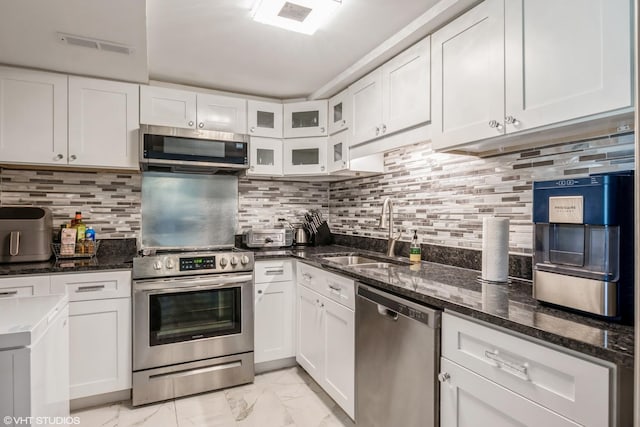 2237 175th St Unit 2A, Lansing, IL 60438 - kitchen with stainless steel appliances, light marble finish flooring, a sink, and white cabinetry