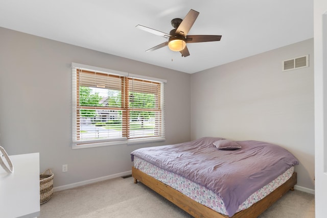 807 Meadow Ln, North Aurora, IL 60542 - bedroom with carpet floors, baseboards, and a ceiling fan