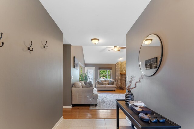 807 Meadow Ln, North Aurora, IL 60542 - hall with light tile patterned flooring and baseboards