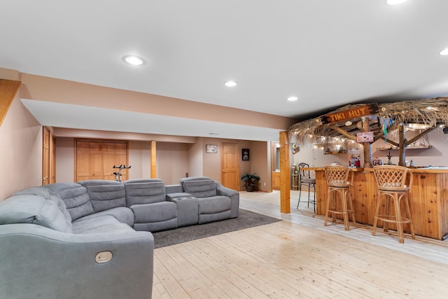 807 Meadow Ln, North Aurora, IL 60542 - living room with bar, light wood-style flooring, and recessed lighting