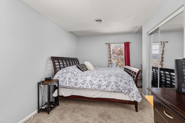 carpeted bedroom with a closet