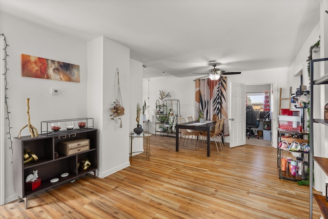 interior space with light wood-style flooring and a ceiling fan