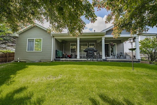 rear view of house featuring a porch
