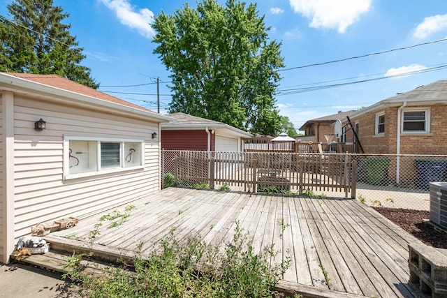 2820 W 100th Pl, Evergreen Park, IL 60805 - wooden terrace with an outdoor structure, fence, cooling unit, and a garage