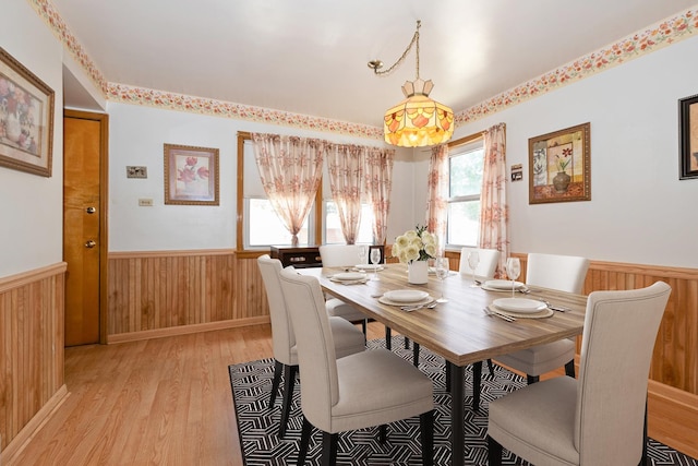 2820 W 100th Pl, Evergreen Park, IL 60805 - dining space featuring a wainscoted wall, light wood-style flooring, and wood walls