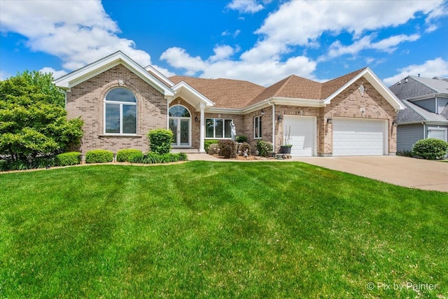1122 Souders Ave, Elburn, IL 60119 - ranch-style home featuring brick siding, an attached garage, concrete driveway, and a front yard