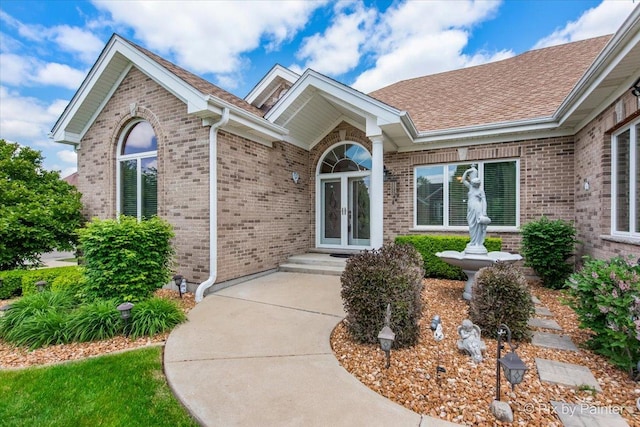1122 Souders Ave, Elburn, IL 60119 - entrance to property with brick siding, french doors, and a shingled roof