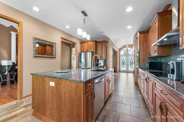 1122 Souders Ave, Elburn, IL 60119 - kitchen with wall chimney exhaust hood, stainless steel appliances, a sink, brown cabinets, and recessed lighting
