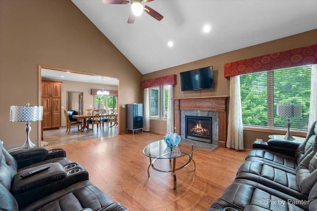1122 Souders Ave, Elburn, IL 60119 - living room with high vaulted ceiling, ceiling fan, a premium fireplace, light wood finished floors, and recessed lighting