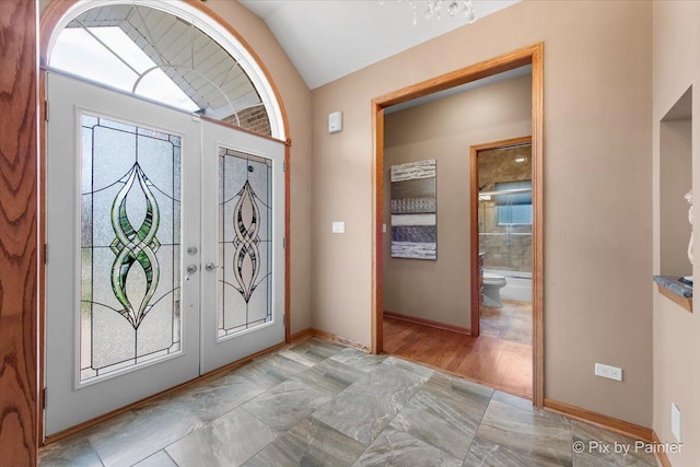 1122 Souders Ave, Elburn, IL 60119 - entryway with lofted ceiling, healthy amount of natural light, and baseboards