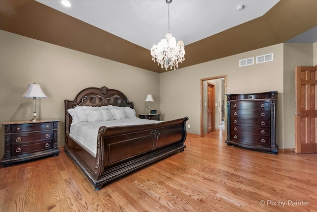 1122 Souders Ave, Elburn, IL 60119 - bedroom with light wood-style flooring, a chandelier, and baseboards
