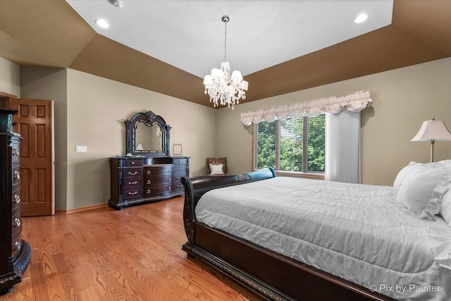 1122 Souders Ave, Elburn, IL 60119 - bedroom featuring wood finished floors, a chandelier, recessed lighting, baseboards, and a raised ceiling